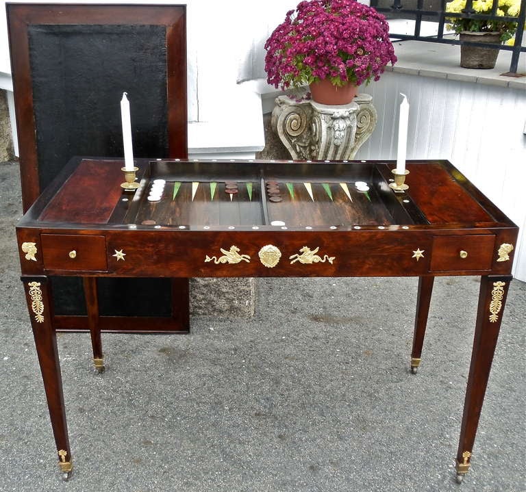 Period Neoclassical First Empire Ormolu Mounted Backgammon Table

--Original Gilt Bronze Neoclassical Mounts
--Original Removable Top with Black Leather Writing Surface on       One Side and Green Felt for Card Games on Reverse
-- Top Removes to