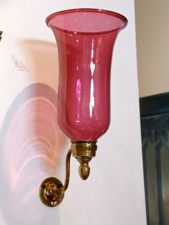 Pair of Nineteenth Century Hurricane Sconces.  Candle fit but can be wired for electricity.  Exquisite and Thickly Blown Hurricane Shades.  Beautiful Cranberry Color