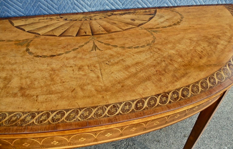 Exquisite Master Work by 18th Century Irish Cabinetmaker, William Moore.

Of the Period, Hepplewhite, with Original Inlays and Finish Surviving Intact.  Demilune Console Pier Table.  Neoclassical Inlays and Marquetry in Rare Woods.  Hallway or