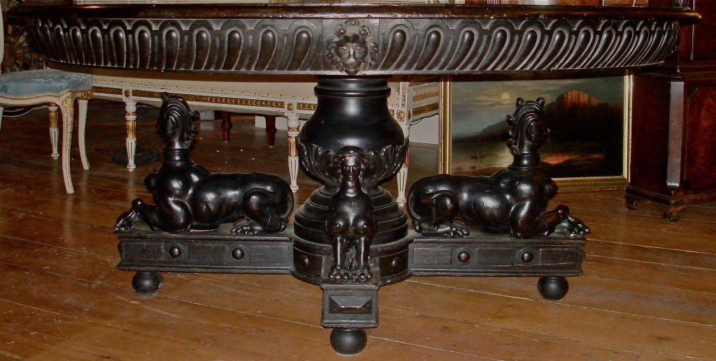 Baronial Ebony Walnut Center or Dining Table.  17th Century Styled Sphinx or Chimera Supports.  Early Silver Form Gadrooned Edge.  A True Masterpiece