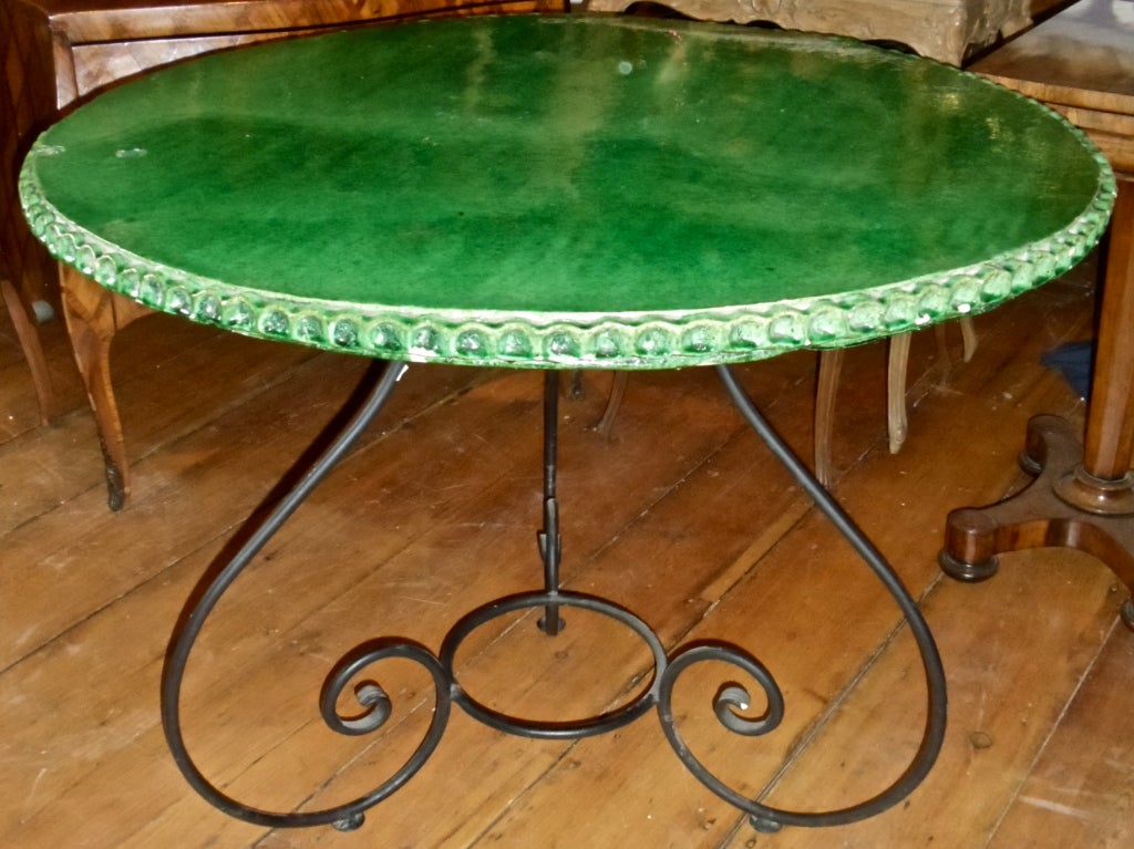 Wonderful Green Glazed Terracotta   and Wrought Iron Center Table from the village of Saint Jean De Fos in the Southern French Languedoc-Roussillon Regoin.

Signed 