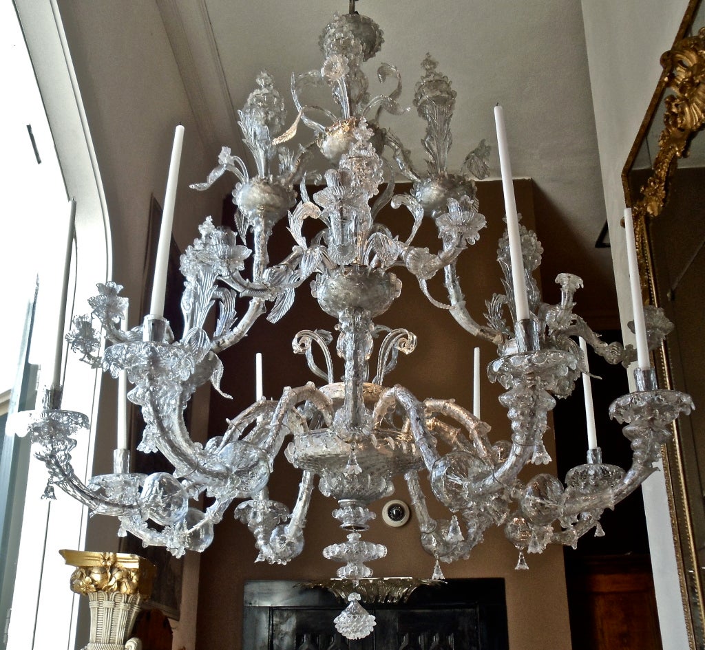 Period 18th Century Clear Glass Venetian Chandelier.  Handblown Murano Island Venetian Glass Supported by Hand Hammered Silvered Iron Frame.  24 arms.  Baroque Work with Three Tiers of Poppies.  The top most tier, realistically styled poppies in