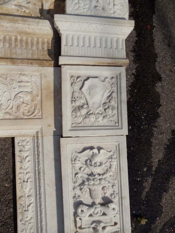 Removed from a Back Bay, Boston, McKim, Meade and White Mansion.  Large Scale American Carved Marble Mantle in Renaissance Revival and Partial Neoclassical Style.  Inner Liner with Medusa Head.  Griffin Frieze and Classical Capital Pilasters, Egg