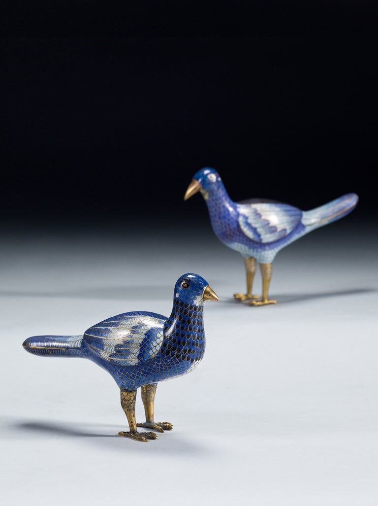 A charming pair of early 19th century blue ground Cloisonné birds representing a male and a female.