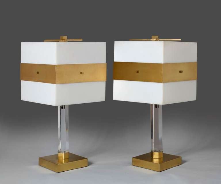 A pair of Lucite and brass lamps with bold geometric design.

Italy, circa 1970.

Height: 25 in. (63.5 cm).
Shade: 12 in. sq. (30.5 cm).
Base: 7 in. sq. (17.75 cm).

Mallett id: L3D0321.