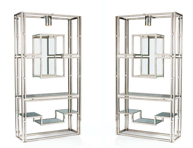A pair of chrome étagères by Kim Moltzer, each having a central downlighter and mirrored back panel and lower shelves. (F3B0334)

Kim Moltzer (born 1938), a Swiss architect, designer and sculptor, lived and worked in Paris in the 1960's and early