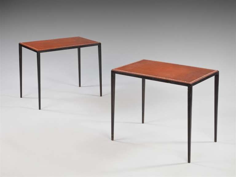 A fine pair of patinated iron and leather side tables designed by Jean-Michel Frank. Commissioned by the Berardi family from Comte, Buenos Aires, circa 1940. By descent to A. Daniel Berardi. With a certificate of authenticity from the Comité