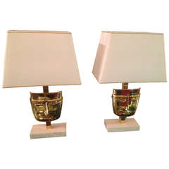 Pair of Brass Mask Lamps on Stone Bases