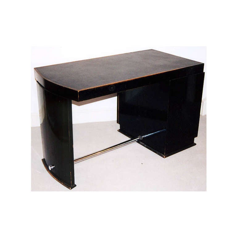 An ebonised and chrome Art Deco desk with original black inset leather top.
French, circa 1930.

Width:   41/2