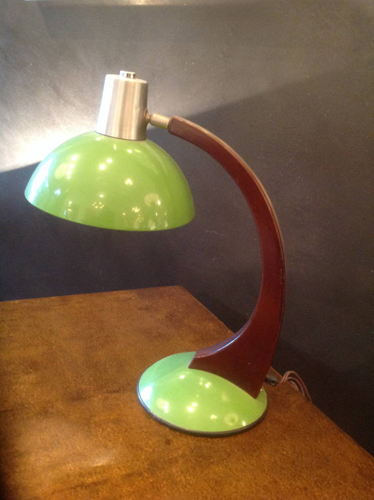 Table lamp designed by Luigi Brusotti, lacquered wood and stainless steel with enamel shade and base, prod. Italy ca. 1950
Height 17 ins 43 cms
Max width 12 ins 31 cms