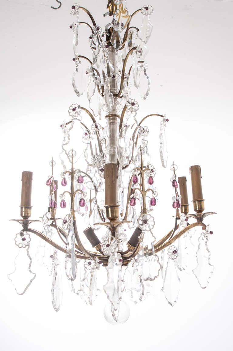Wonderful French chandelier from the 1800s. The center style of brass has a blown glass surround, extending brass arms hold a stunning collection of clear cut crystal drops, sprinkled with purple glass tear drops. The purple color really adds depth