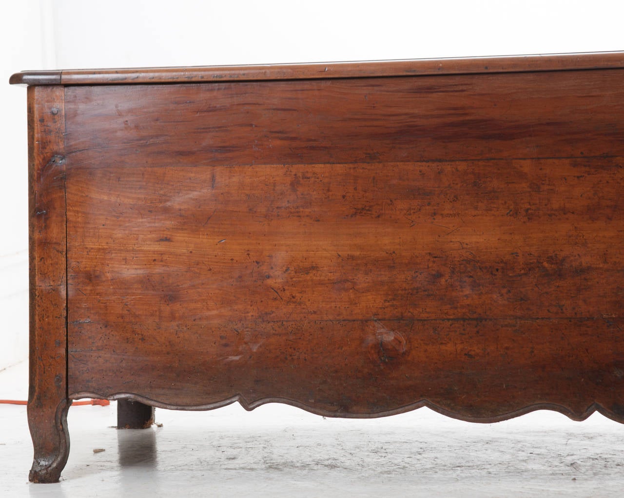 A massive solid walnut wood coffer / trunk from North West France in Brittany. This trunk is from the Louis XV period and has stood the test of time. Simple in design, this is the largest trunk we have ever seen! The top is very heavy, see the the