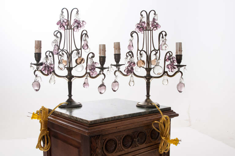 Adorable pair of French candelabra adorned with clusters of glass fruit and droplets. Brass plate sconces are now U.S. electrified with two lights each, circa late 1800s.