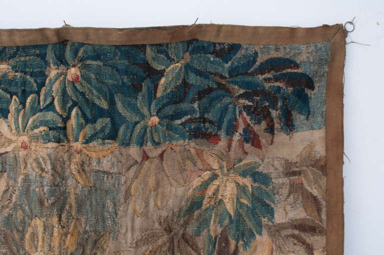 Wonderful tapestry of silk and wool weaving with a thick, knotty texture. You can see it's age in the detail photos with wear and tear making this tapestry all the more interesting. The scene in this tapestry is of a luscious forest with animals and