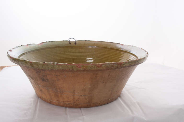 Mixing bowl made in England. Rich, glossy, green interior. It is a beautiful example of kitchenware/kitchenalia from the 19th Century