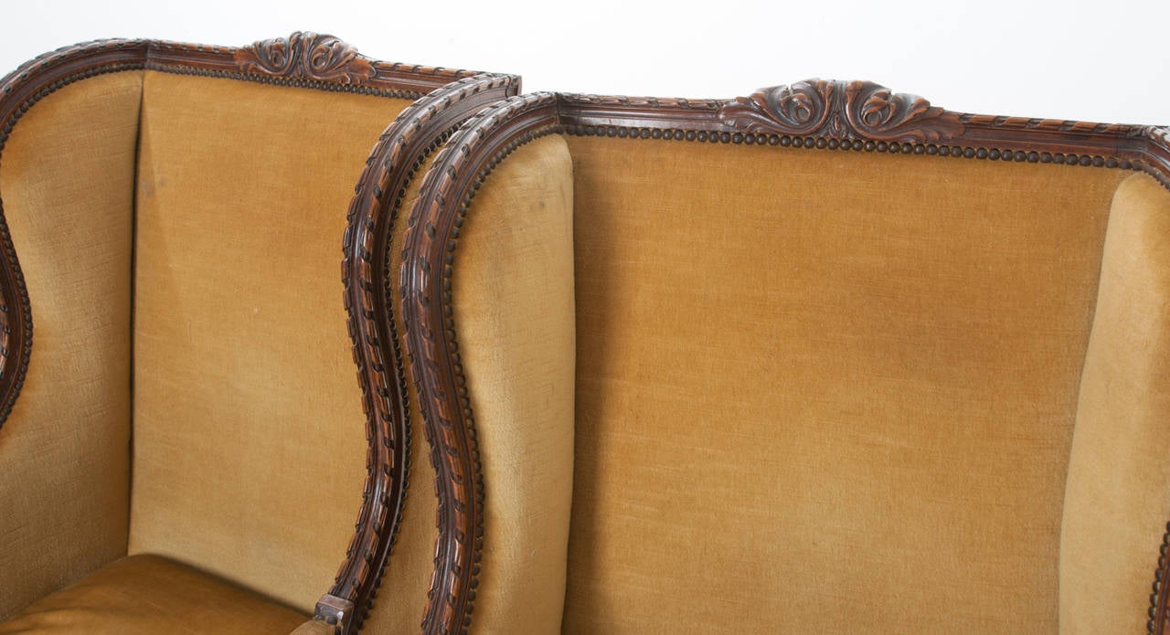 Pair of French 19th Century Carved Walnut Wingback Bergeres In Good Condition In Baton Rouge, LA