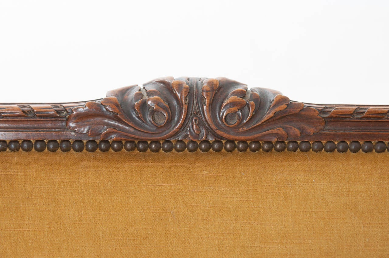Pair of French 19th Century Carved Walnut Wingback Bergeres 1
