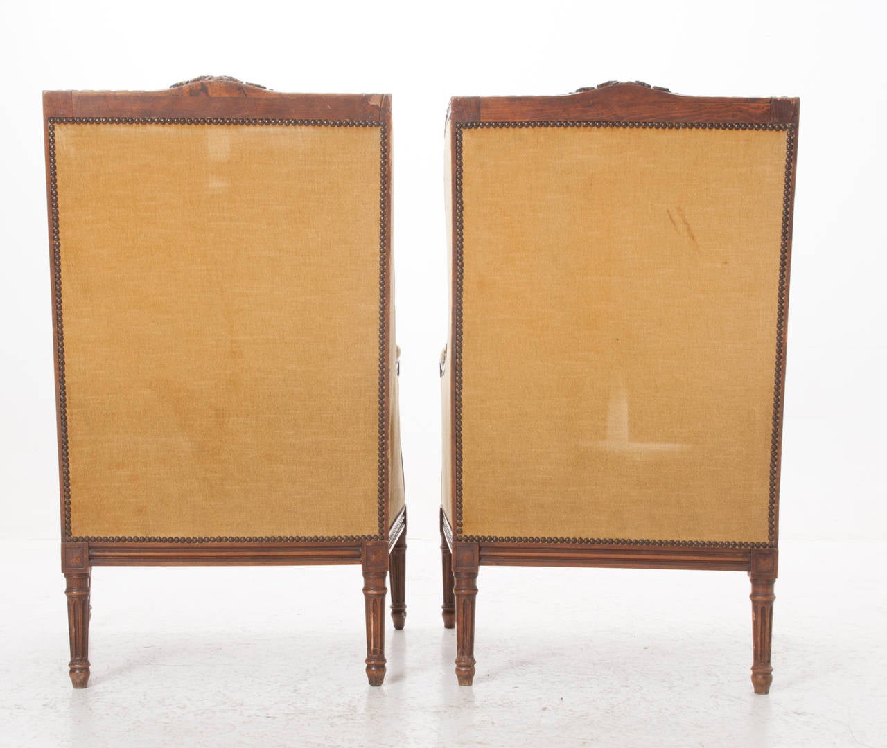 Pair of French 19th Century Carved Walnut Wingback Bergeres 5