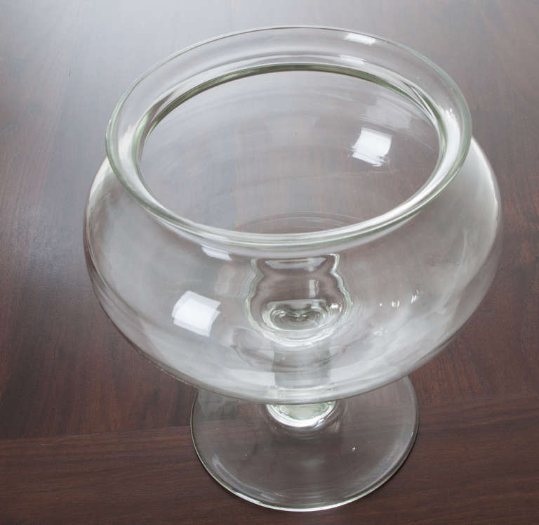 In the 1800s having a fish in a glass fish bowl in your home was a big deal. This bowl is made of thick rolled glass, the mouth is 7 1/2"diameter, the base is 6 1/4"diameter.