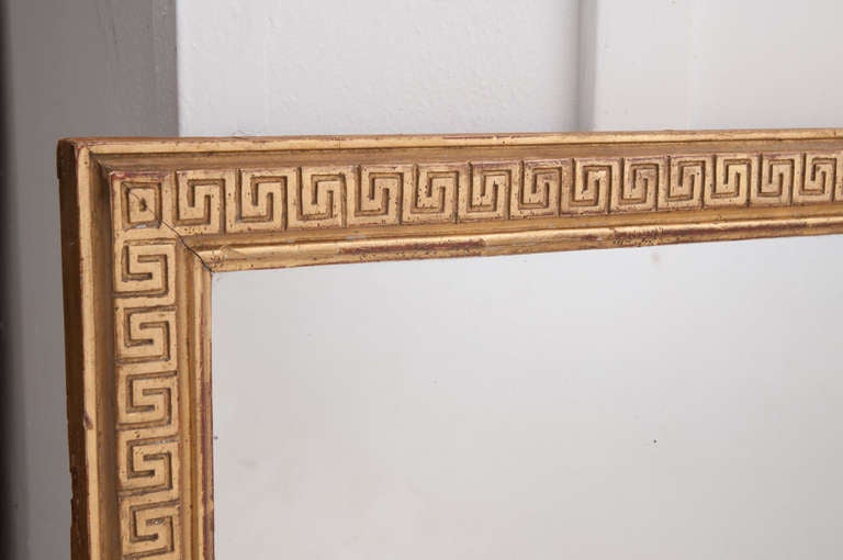 Wonderful Greek key motif on this fine gold gilt mirror from the 1820's with original mercury mirror glass, has lots of sparkles.