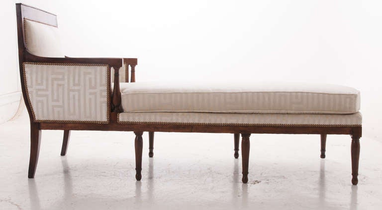 This wonderful unique directorire style chaise longue is impressively long at 6 1/2 feet! We have never seen one of this size and thought it would make a wonderful addition to any antique lovers home. The frame is made of walnut with a fresh French