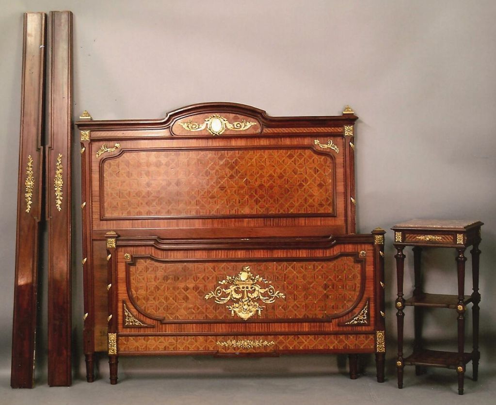 French kings-wood, mahogany and walnut parquetry Louis XVI style 3-piece bedroom suite. Late 1800's with armoire, marble top nightstand and queen sized bed. Impressive kings-wood chevron veneering with cross banding. The whole with cabochon, ribbon,