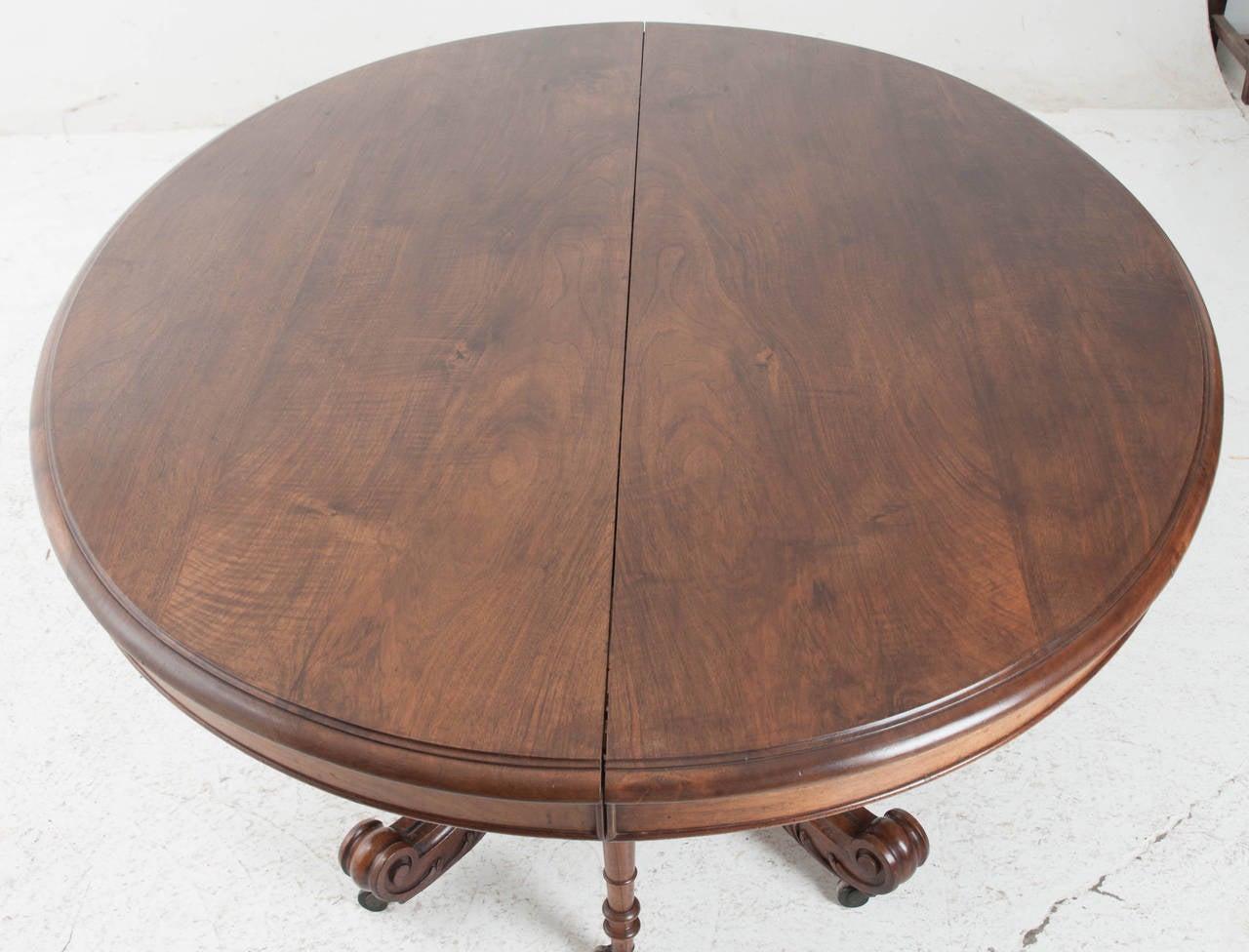A very handsome and intriguing pedestal dining table extending up to14'-6
