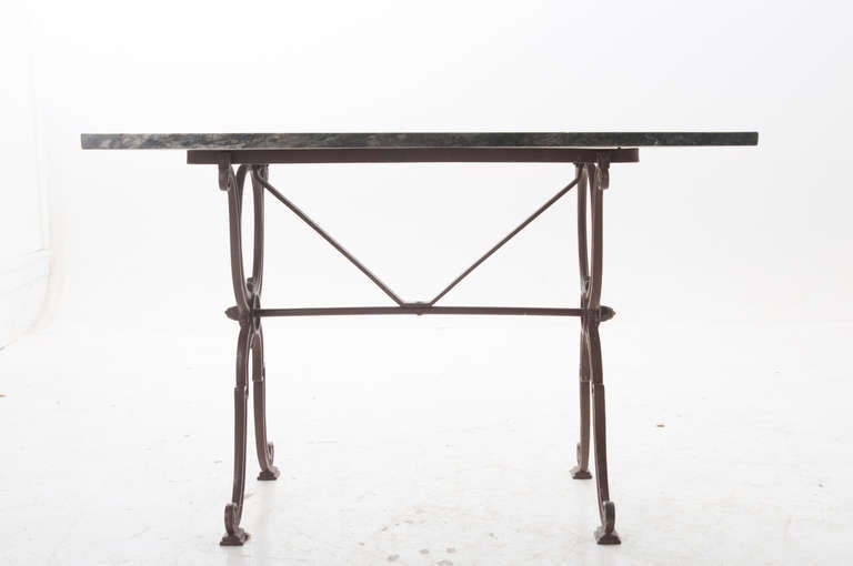 Iron and marble bistro table from Clermont Fils Perpigan. Painted iron base with older marble top, finished on three sides.