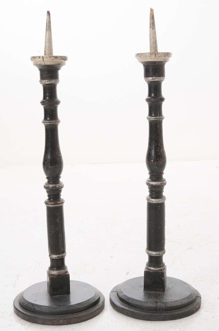 Italian pair of tall carved and painted candlesticks, 1920-1930.