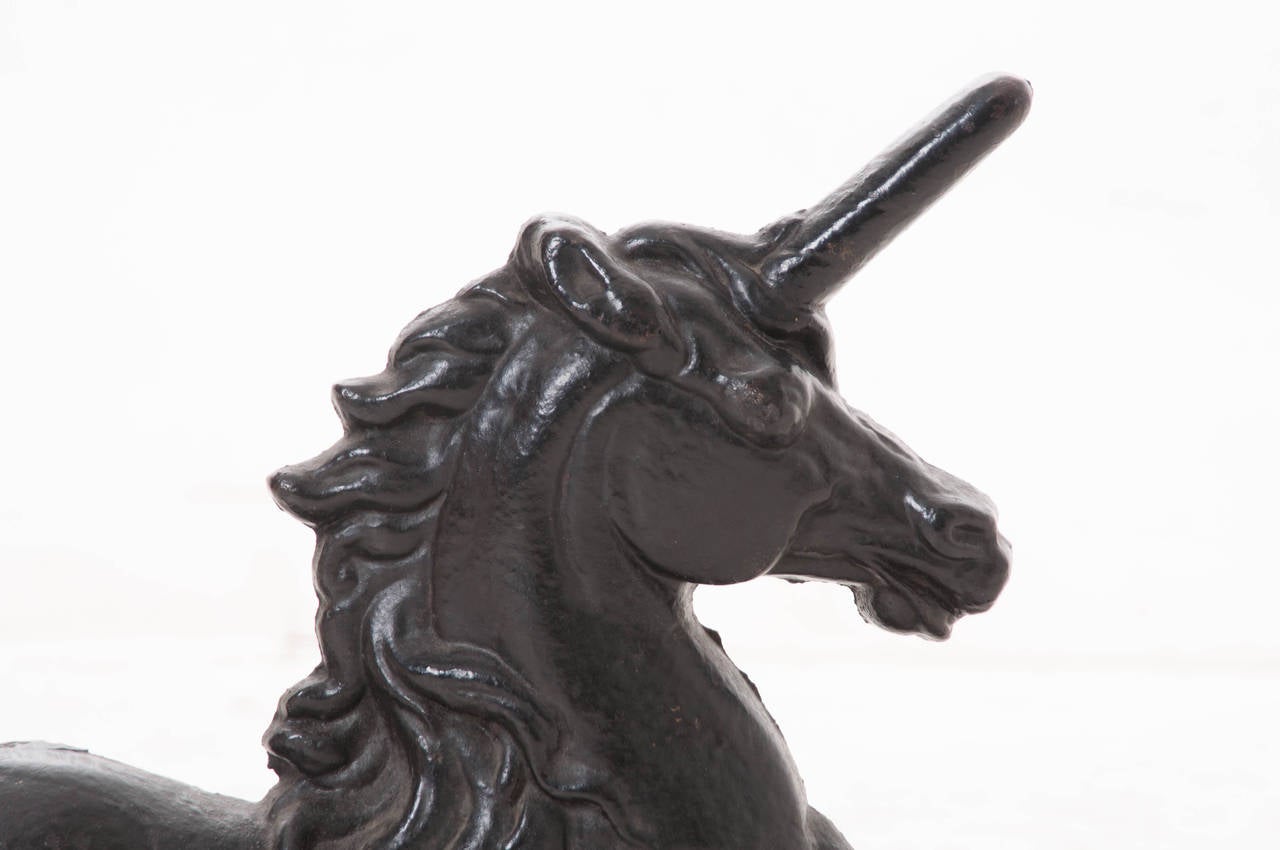 A fabulous, heavy, cast iron unicorn from France. Custom-made. This unicorn was once used as a door stop. c.1950s.