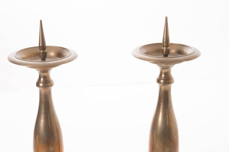 A stunning pair of sculptural brass candlesticks of large size! Tripod bases end with three paw feet, 1870s.