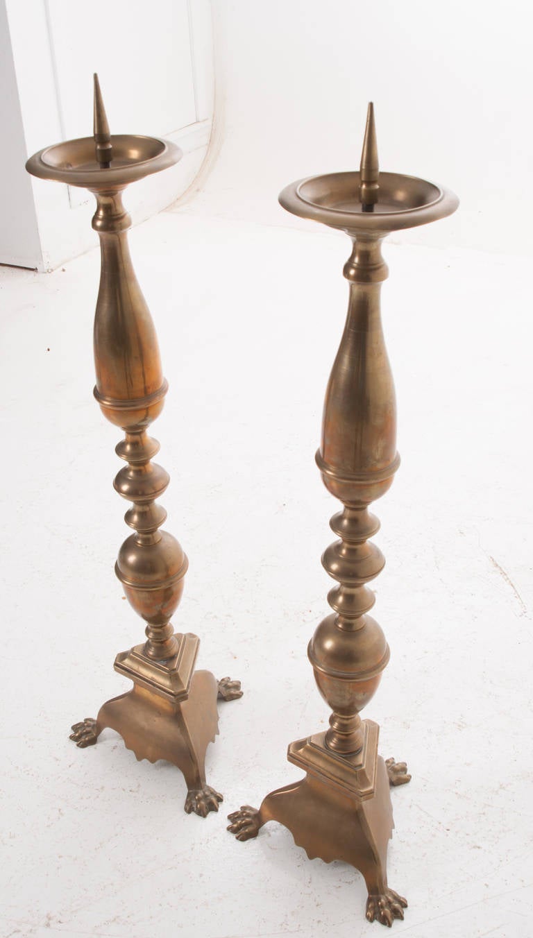 Patinated European Pair of 19th Century Brass Candlesticks with Paw Feet For Sale