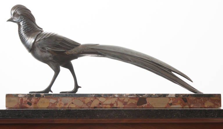 A wonderful statue from the 1920s of a bronzed pheasant on two different types of marble, both used in many Art Deco designs.
