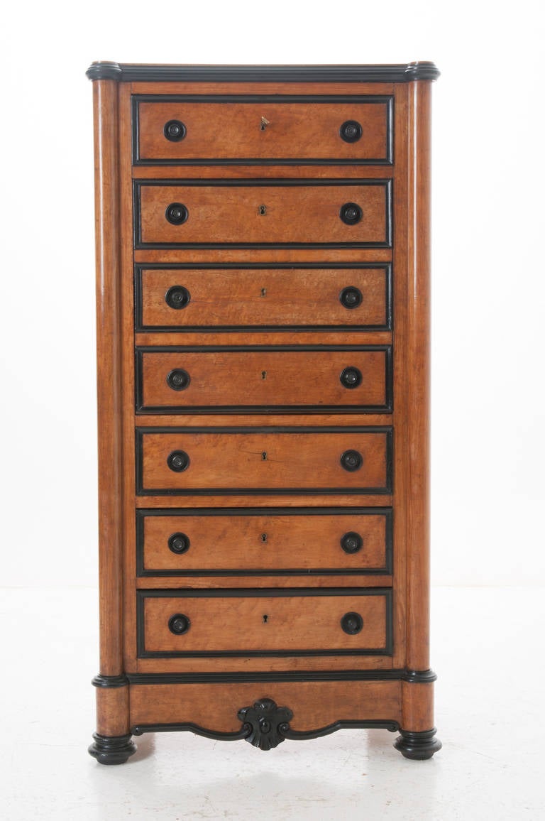 An adorable Louis Philippe drop front secretary! Bird's-eye maple wood with ebony detailing all hand-carved and in wonderful condition. Sever drawer's stand tall, hiding the desk with all locks working. Drawers 1, 5, 6 & 7 are great storage drawers.
