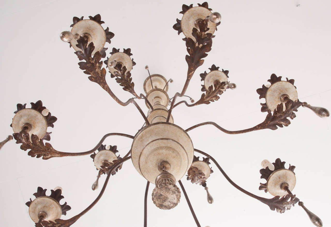 Large painted 12 light chandelier of stunning size and finish! Newly made and imported from Italy. This fun chandelier is beautiful and practical, giving off plenty of light. Cleaned and U.S. wired.