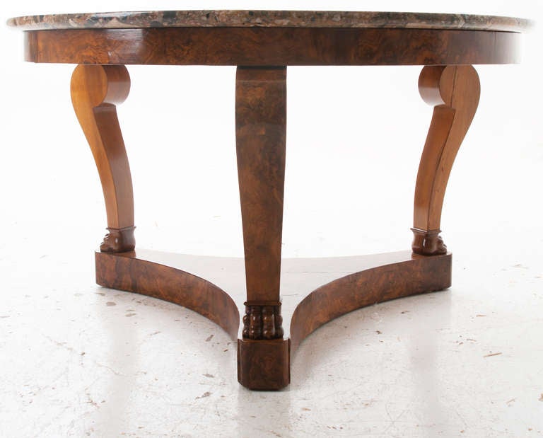 French Restoration thick cut marble top gueridon center table made of burled walnut and cherrywood. Stunning size and patina, thick grooves are present in this marble top of many colors but have not needed repair, c. 1810.  