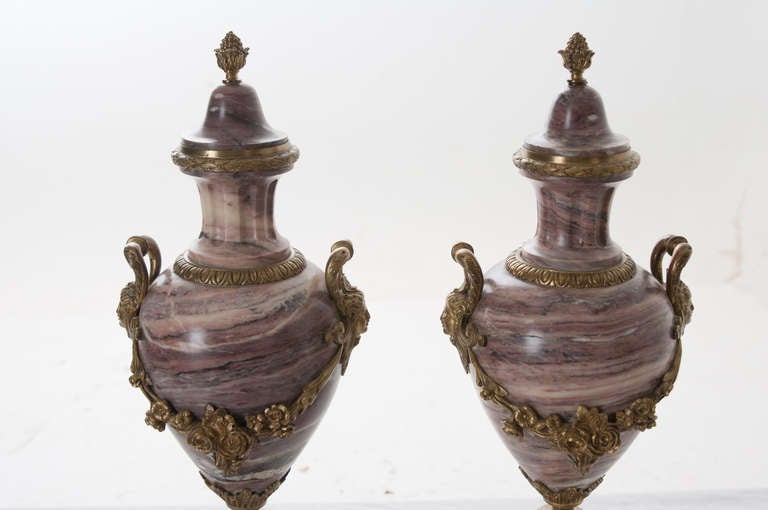 French pair of purple marble and Bronze cassolettes with floral, foliate, leaf and berry, and mask motifs. c. late 1800s