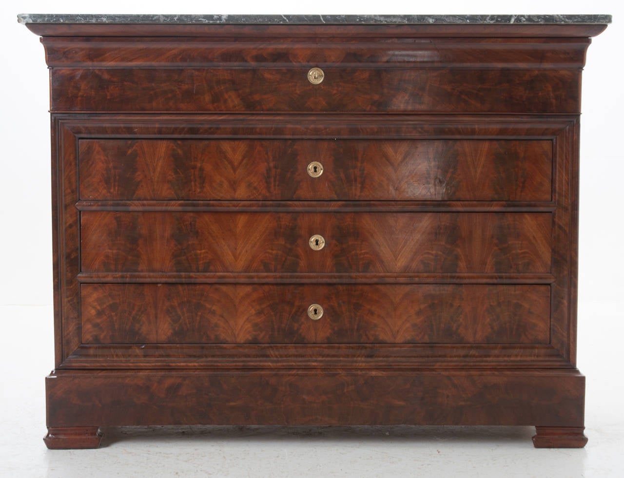 The commode / secretary is always one of our favorite antiques to have in the shop, we love the hidden treasures. The original marble top sits over this fine commode of 4 drawers and 1 desk. The interior of the desk is fitted with 3 drawers and one