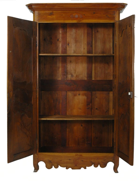French walnut armoire with wonderful modern detailing on the doors of this c.1850 or earlier armoire. <br />
8' - 7 1/8