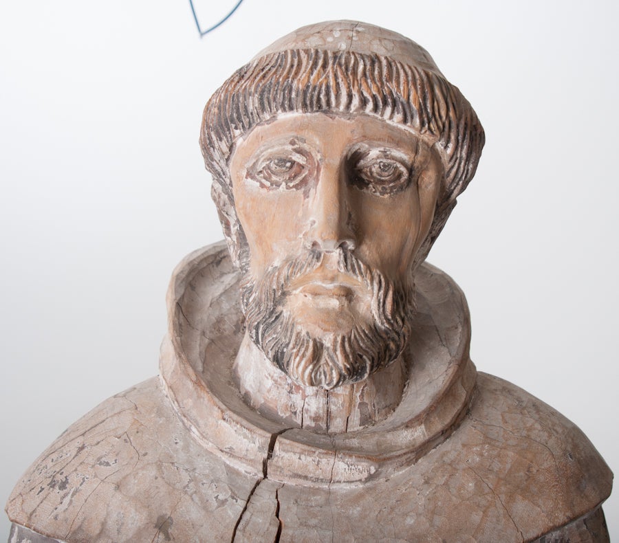Italian hand carved wood with worn paint statue of Saint Francis of Assisi. Saint Francis of Assisi was an Italian Catholic friar and preacher. He is known as the patron saint of animals, the environment and one of the two patrons of Italy with