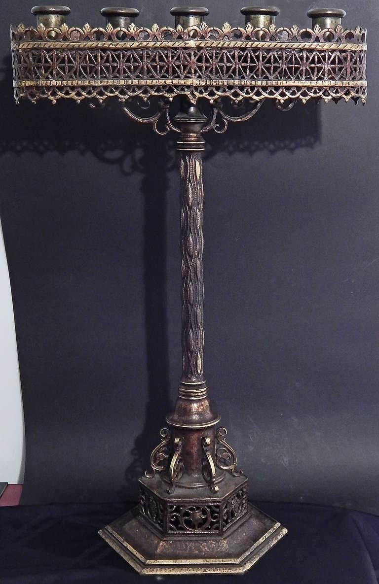 Large, beautifully detailed and retaining their original, lustrous patina, this very rare pair of bronze candelabra were created by the renowned workshop of Oscar Bach, America's foremost metal craftsman in the 1920s and 1930s.  The base of each