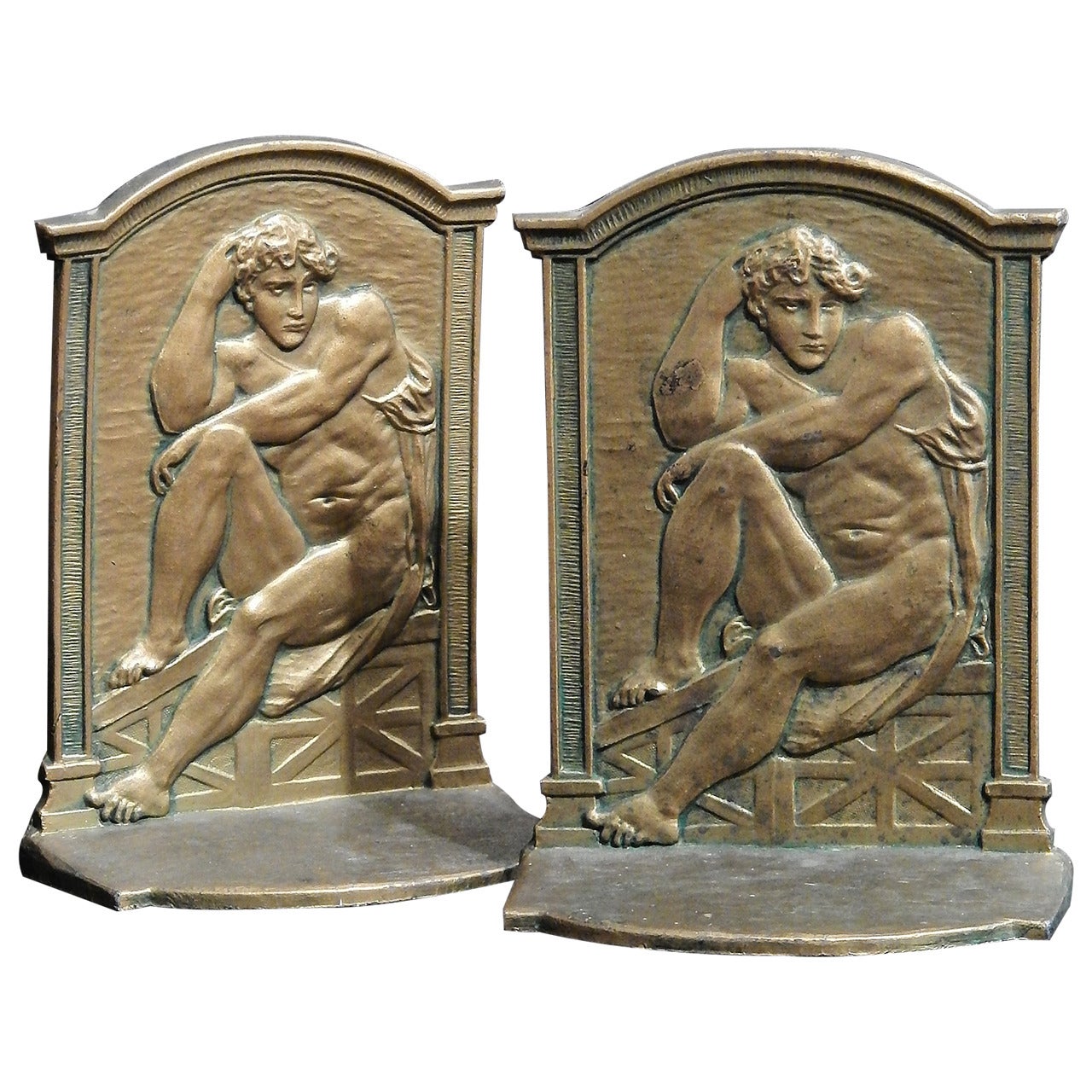 Seated Nude Male Bookends with Fine Bas Relief Detail