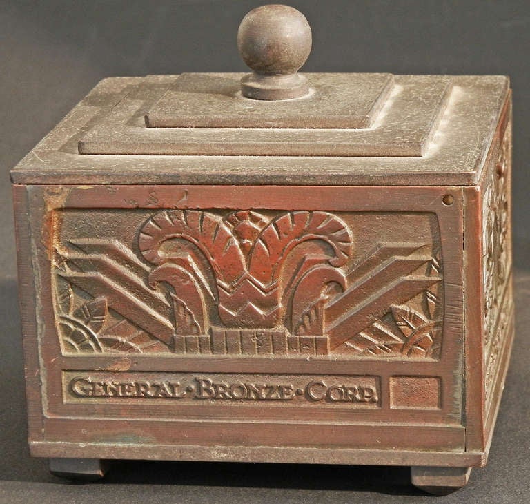 Celebrating the formation of the General Bronze Corporation, this beautifully crafted bronze box was created in 1928. It is decorated with high-style Art Deco motifs on two sides, and with Italian Renaissance motifs complete with griffins and a
