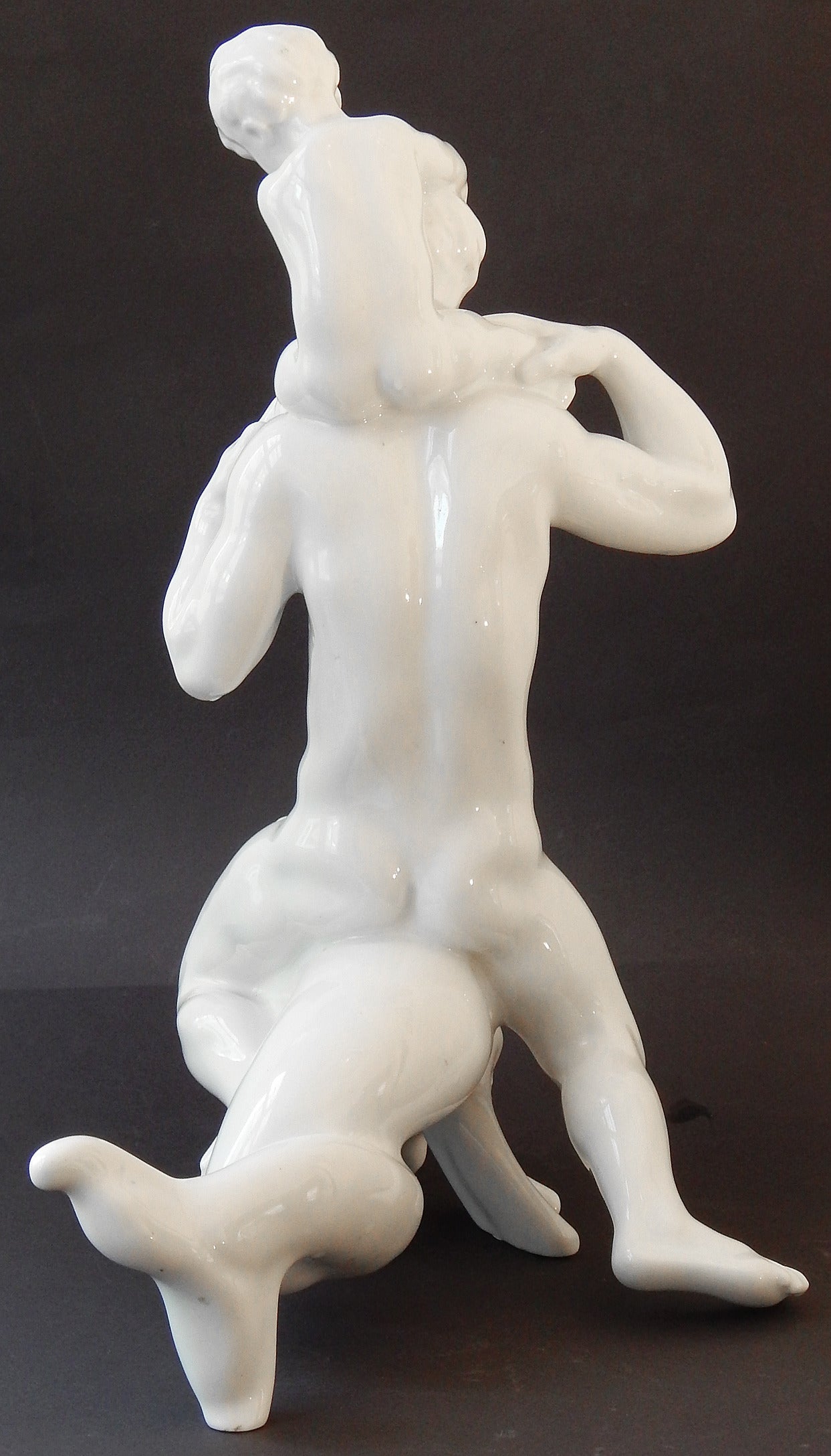 Sleek and sensual, this large, extraordinary porcelain sculpture was created by Kai Nielsen, Denmark's leading figurative sculptor in the first decades of the 20th century. Nielsen was fascinated with nude human figures relating to sea animals such