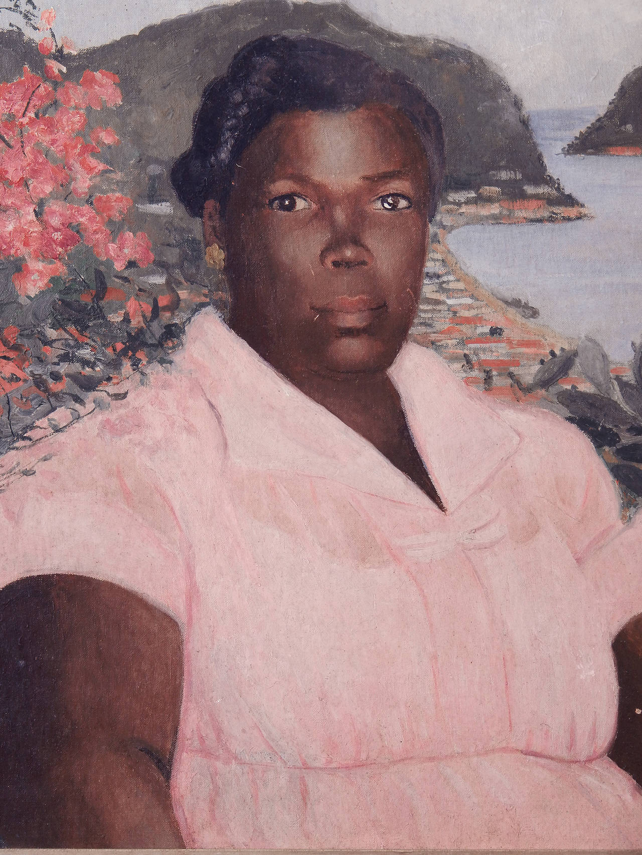 Depicting a Caribbean woman full of light and intelligence, this gorgeous portrait shows its subject in a pink dress, flanked by a tropical flowering bush over one shoulder and a stunning view of a secluded harbor over the other. The painter