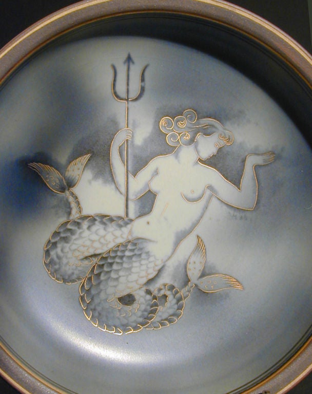 Gunnar Nylund, who worked for Rorstrand from 1931 to 1958, developed this rich “Flambe” glaze.  Special pieces were decorated with sensuous scenes featuring mermaids, as in this case.  The bottom of this bowl is marked “Gott Nytt Ar 1944,” or Happy