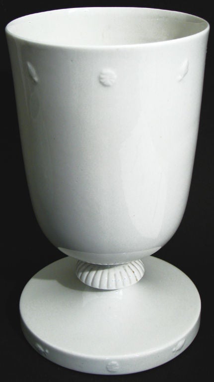 Produced by the Lamberton porcelain works in Trenton, New Jersey, not far from the famed Lenox factory, this late Art Deco vase was probably designed and sculpted by Geza de Vegh, in a style reminiscent of the work of Tommi Parzinger.  It features