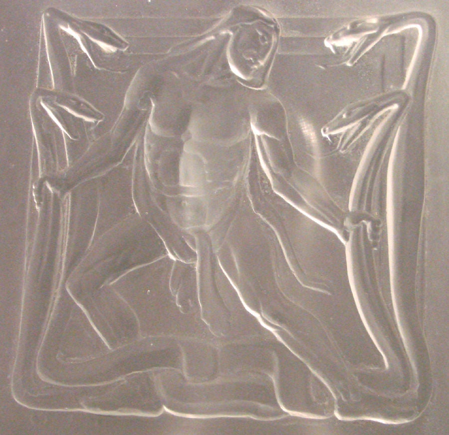 Rare and powerful, this very fine bas relief panel in satin-finished glass, probably French, depicts a powerful nude Hercules battling a stylized Hydra monster with four heads.  Hercules is depicted with his trademark cloak made from a lion's hide.