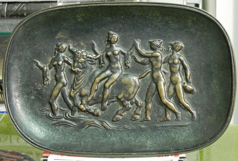 This lovely and elegant scene, depicting Europa on her mythological bull, surrounded by nude bathers carrying water jars and towels, was sculpted by Fritz Nuss in the late 1940s. One of Germany's few sculptors who continued working in a classicized