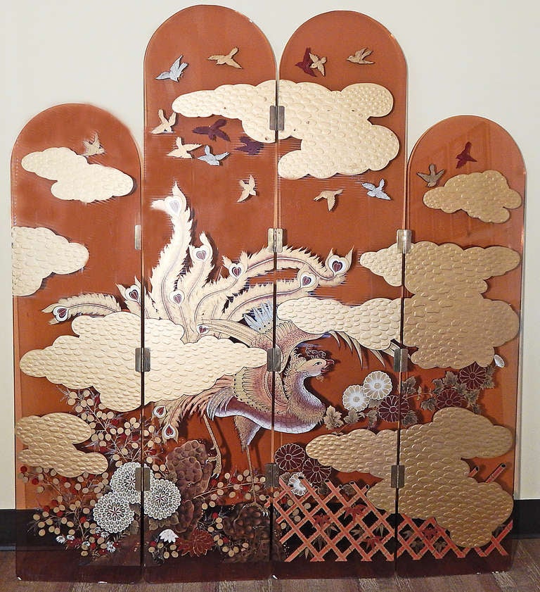 Quite extraordinary and probably unique, this hand-painted folding screen depicts -- on each side -- a peacock striding among flowers in a trellised garden, with clouds at every level and circles of birds in the sky. Very finely painted in tones of